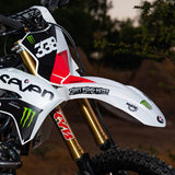 Graffiti-style die-cut stickers applied to a motorcycle front fender