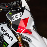 Graffiti-style die-cut sticker applied to a motorcycle front panel