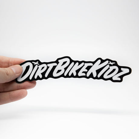 DBK script fender sticker held in hand, black and white graphic