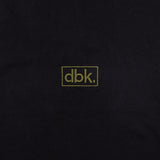 Black T-shirt fabric close-up with dbk logo patch