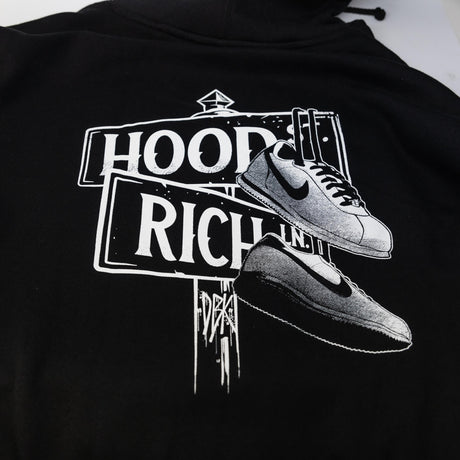 Black hoodie back graphic with 'HOOD' and 'RICH' text and sneaker illustration.