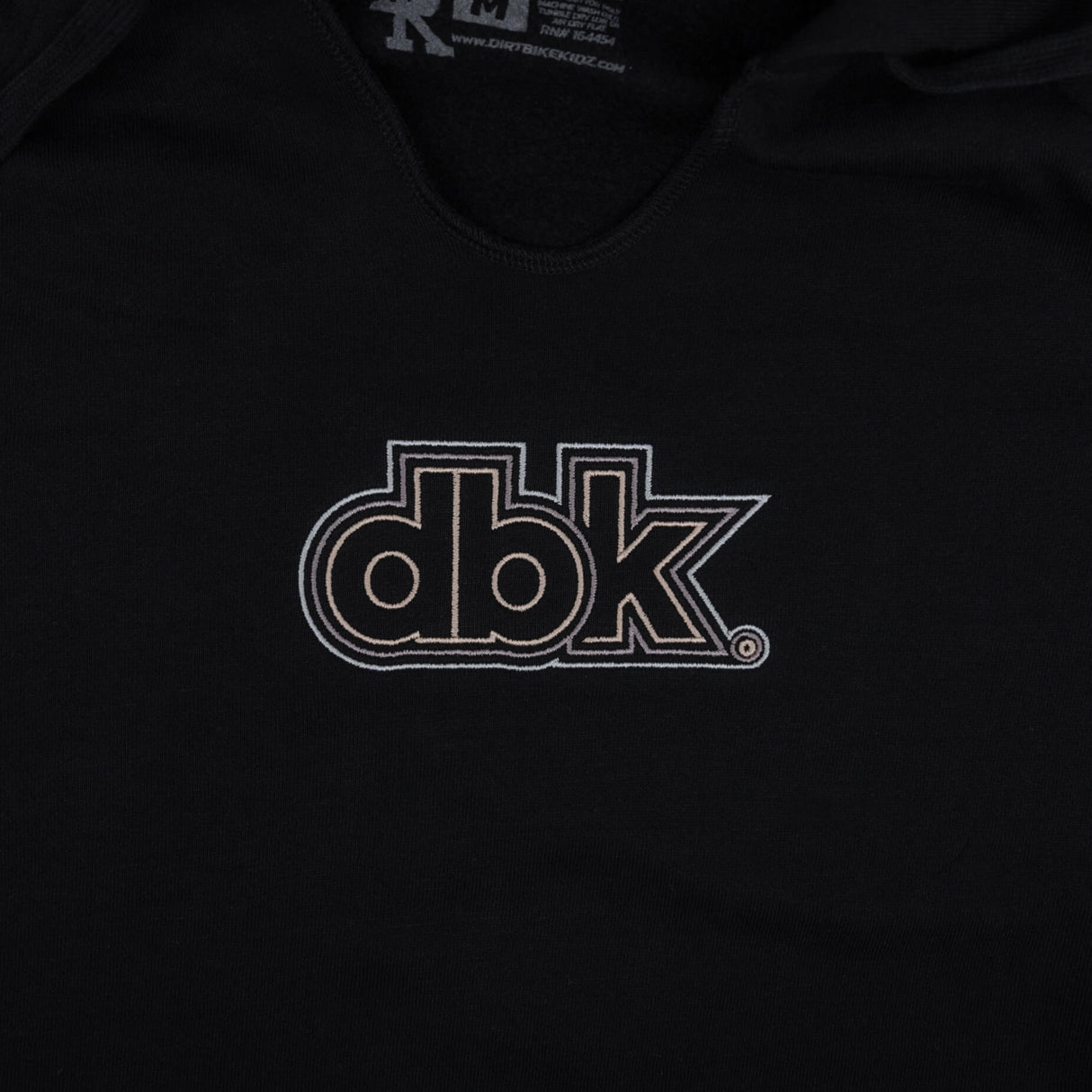 Black women’s hoodie with dbk graphic logo near the center chest