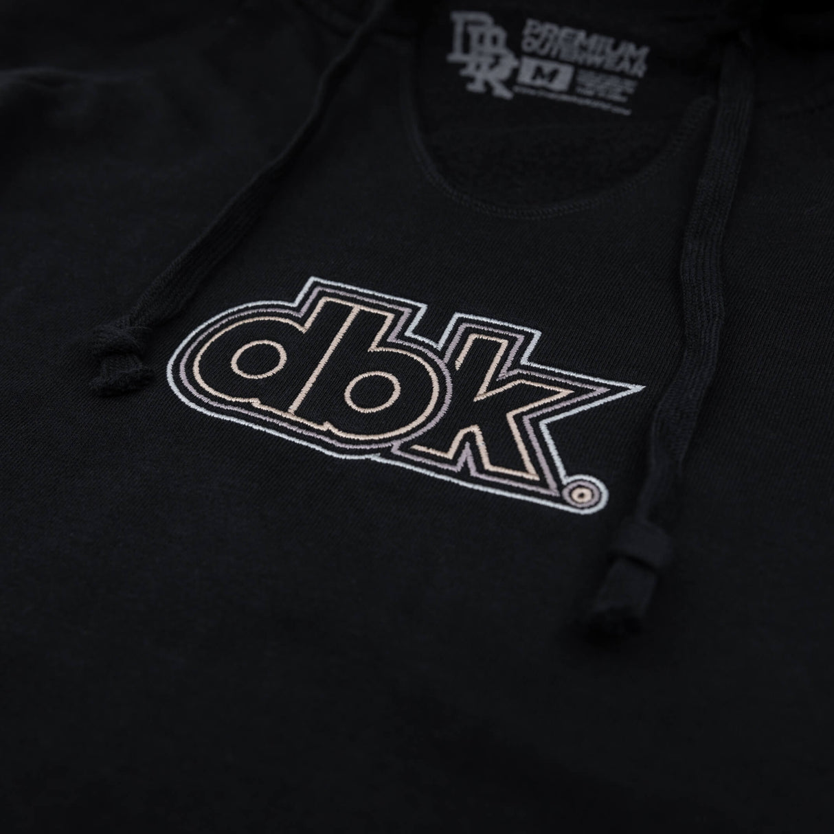 Black women’s hoodie with large dbk graphic logo on the chest
