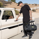 Black tall T-shirt worn with pants, dbk logo on left chest