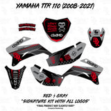 Motorcycle graphics decal set in black with red trim, multiple side panels