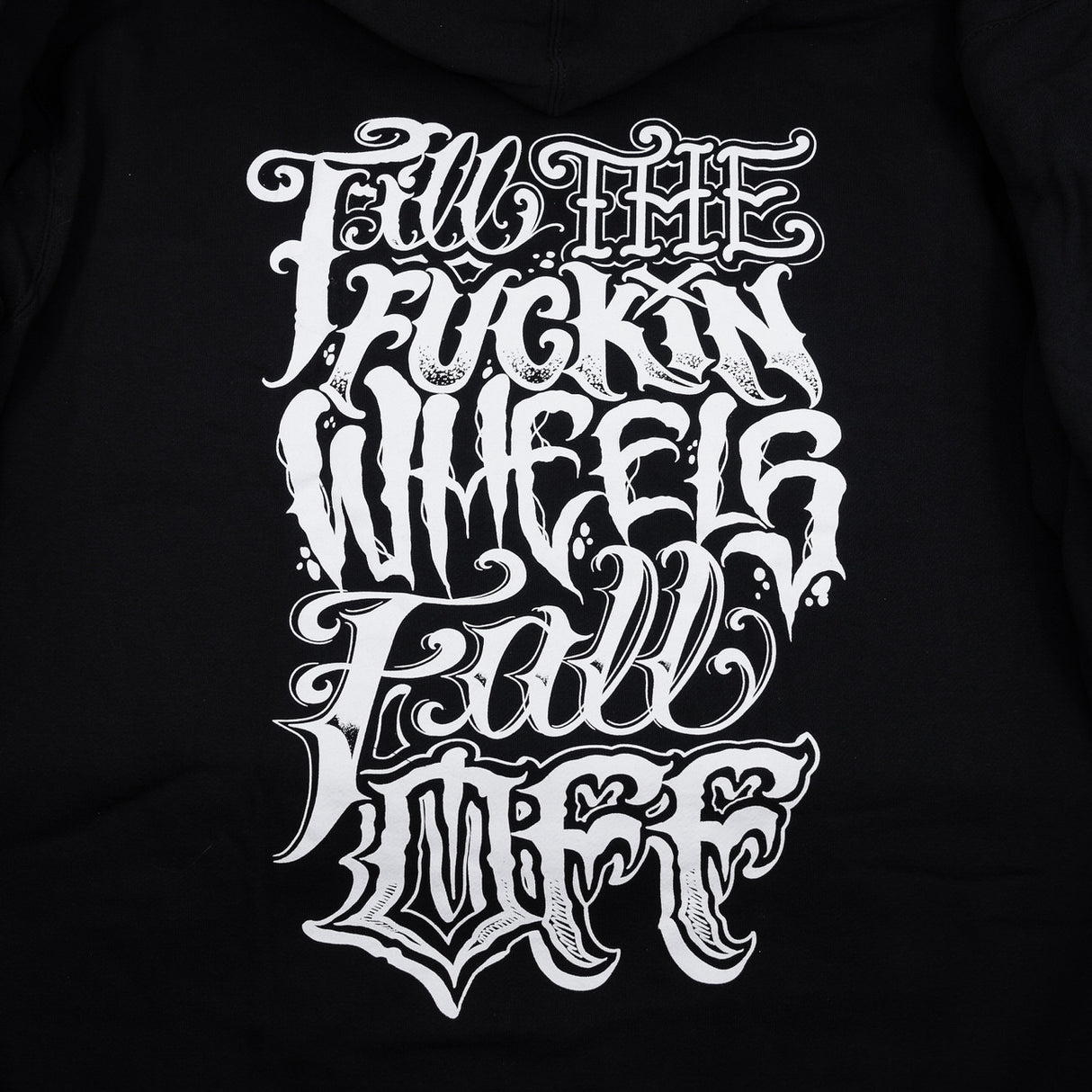 Black hoodie close-up of large front graphic print with high-contrast lettering.