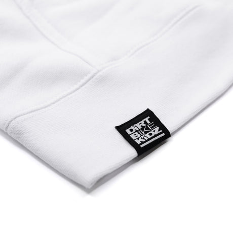 White hoodie sleeve cuff with small brand label tag