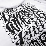 White hoodie fabric close-up with large black graphic lettering design.
