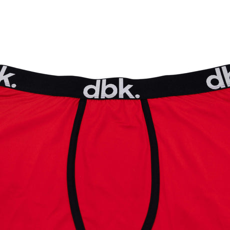 Red boxer briefs close-up of black elastic waistband and center panel