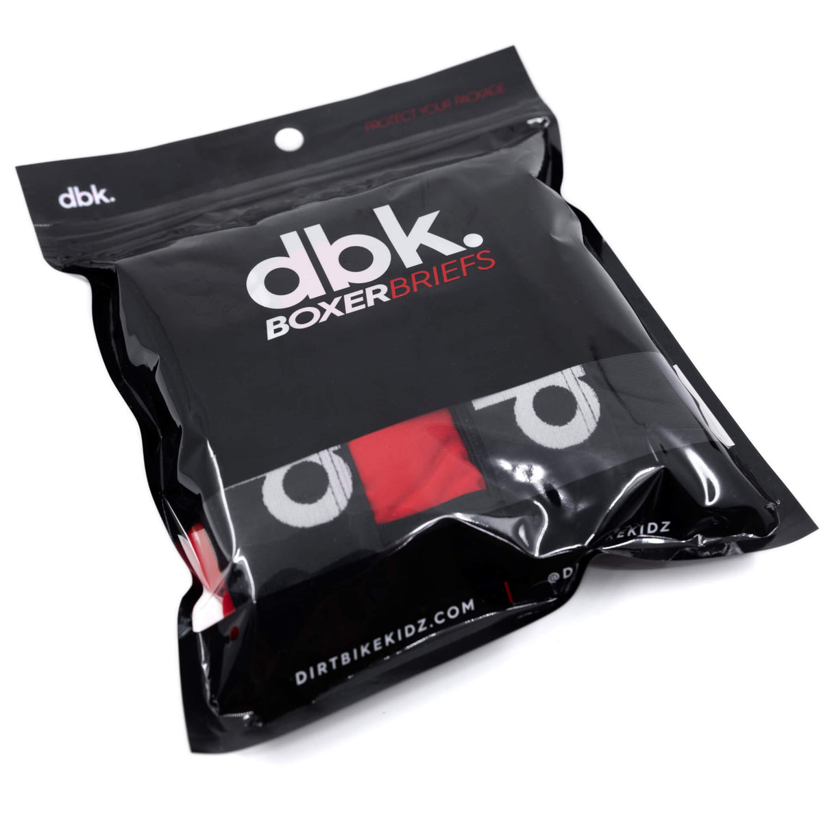 Poly bag labeled dbk. Boxer Briefs with red-and-white print, DirtbikeKidz branding.