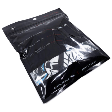 Back of packaging with instructions and a glimpse of black/blue patterned boxer briefs
