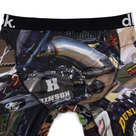 Close-up boxer briefs with engine and “DUNLOP” wheel graphic, black waistband