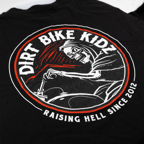 Reaper tee black back close-up with Dirt Bike Kingdom skull riding graphic