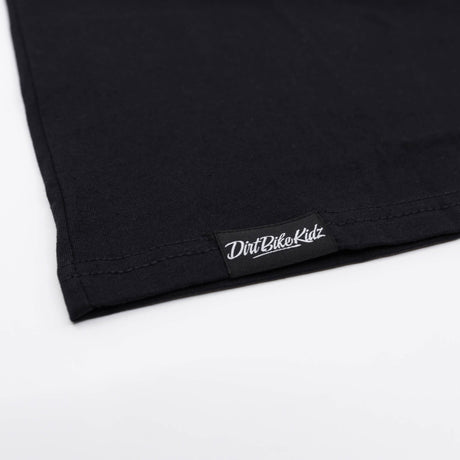 Black youth premium tee hem with stitched Dirtbike Kidz brand tag
