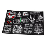 Bike-themed sticker sheet with black background and graffiti decals, tilted view