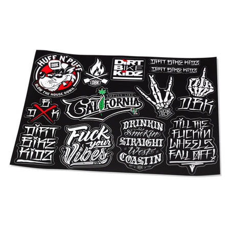 Bike-themed sticker sheet with black background and graffiti decals, tilted view