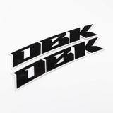 Close-up racer black fender sticker strip with bold black shapes and white border