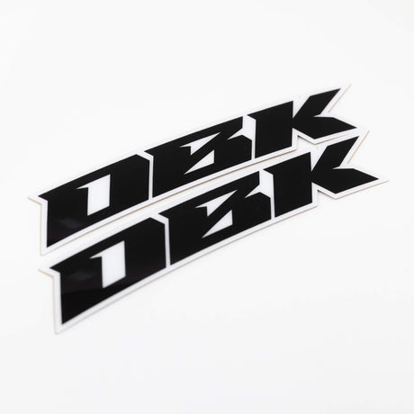 Close-up racer black fender sticker strip with bold black shapes and white border