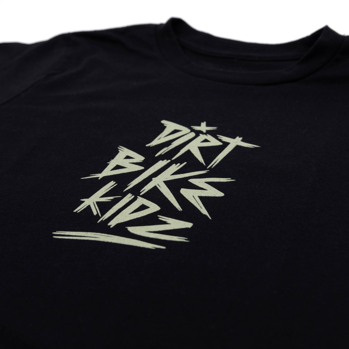 Youth black T-shirt with centered stylized letterform graphic in light gray