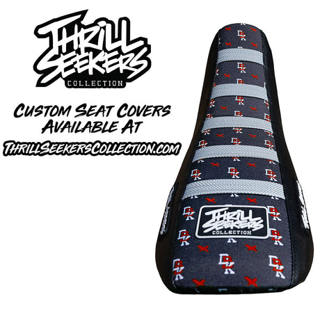 Custom seat cover with navy fabric, gray stripes, and red logo icons