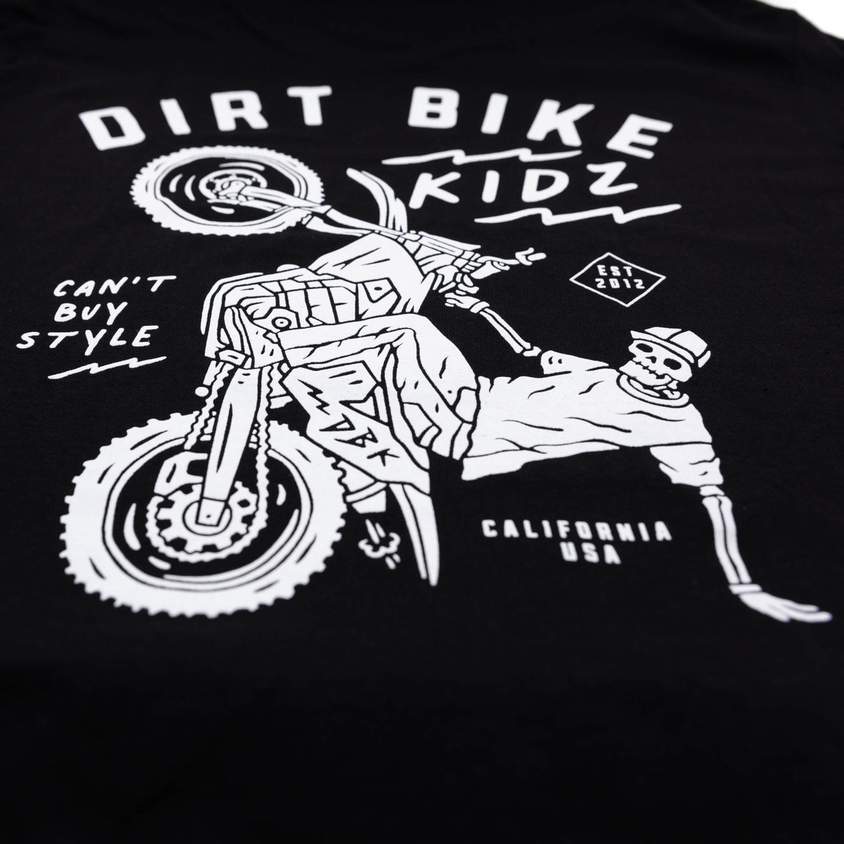 Close-up of black kids T-shirt back graphic featuring dirt bike and rider
