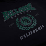Black varsity tee close-up of green “Hillside” front logo and crest
