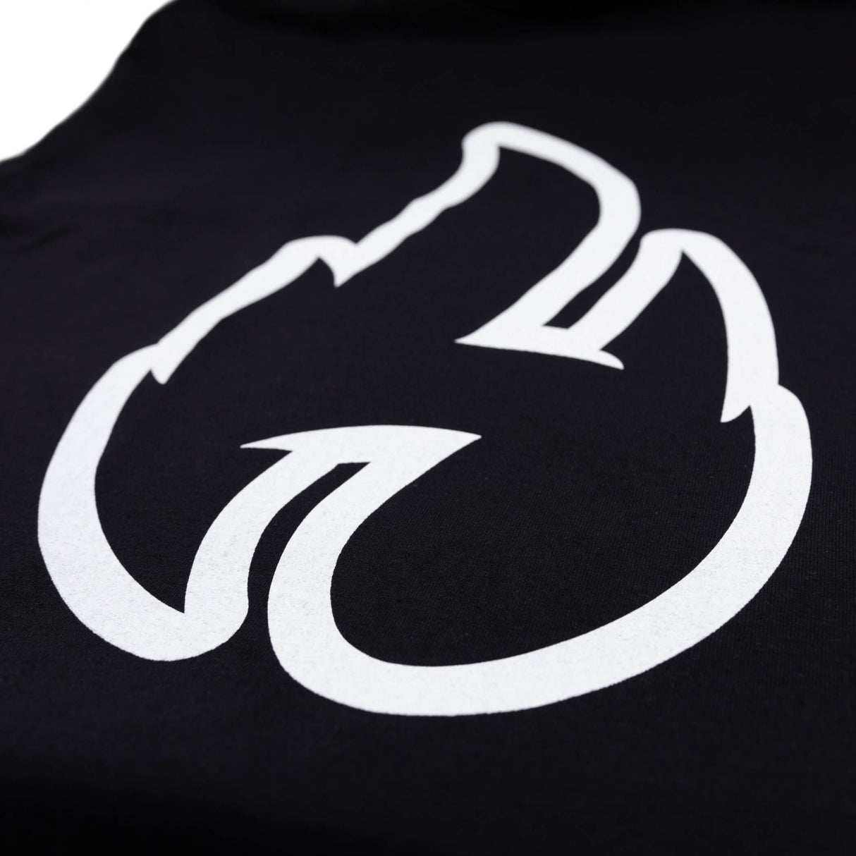 Close-up of large white flame graphic print on a black t-shirt.