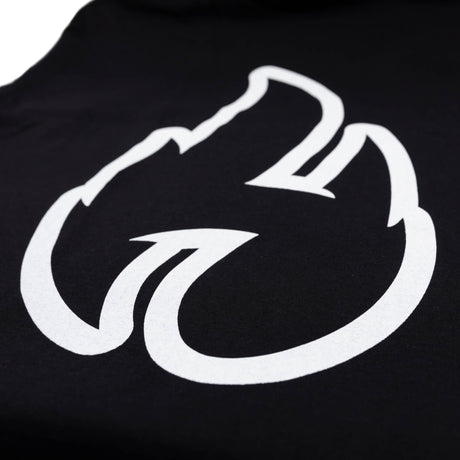 Close-up of large white flame graphic print on a black t-shirt.