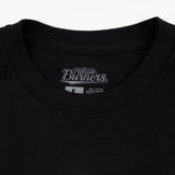 Black t-shirt neckline with Hillside Burners brand logo patch and neck seam.