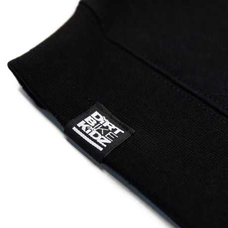 Black hoodie sleeve cuff with woven brand label patch