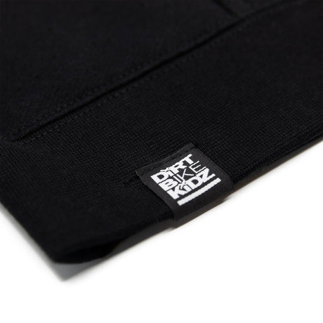 Black hoodie sleeve cuff with small brand label tag