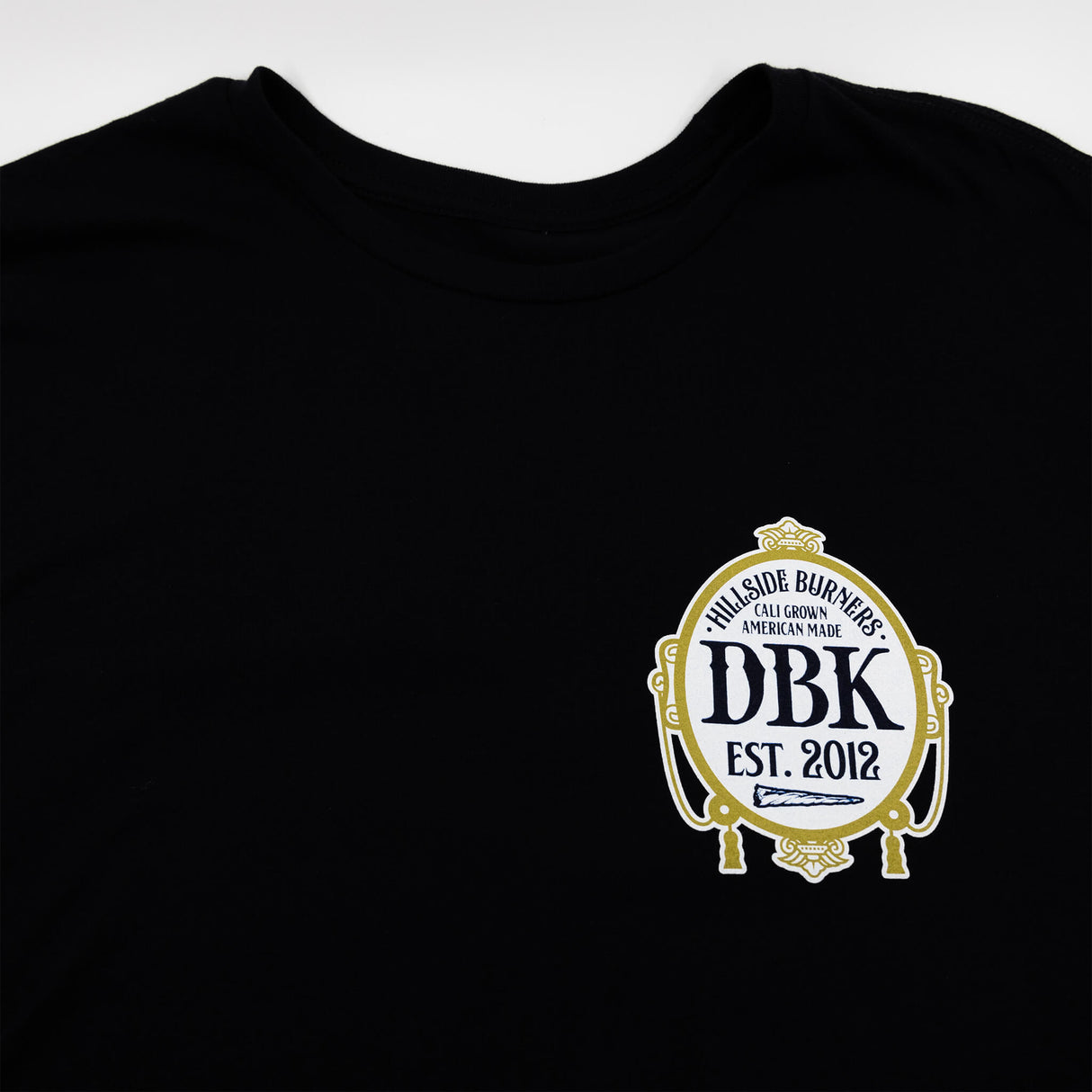 Black tall tee with DBK crest emblem on the chest.