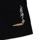 Black T-shirt sleeve with small white graphic and brown cartoon icon
