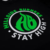 Black Hillside Burners T-shirt close-up of green-and-white circular logo and text