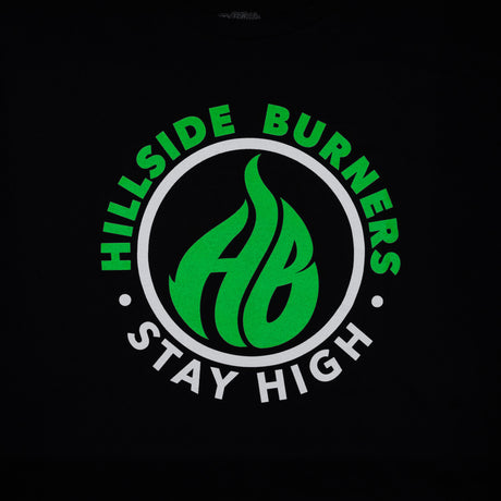 Black Hillside Burners T-shirt close-up of green-and-white circular logo graphic