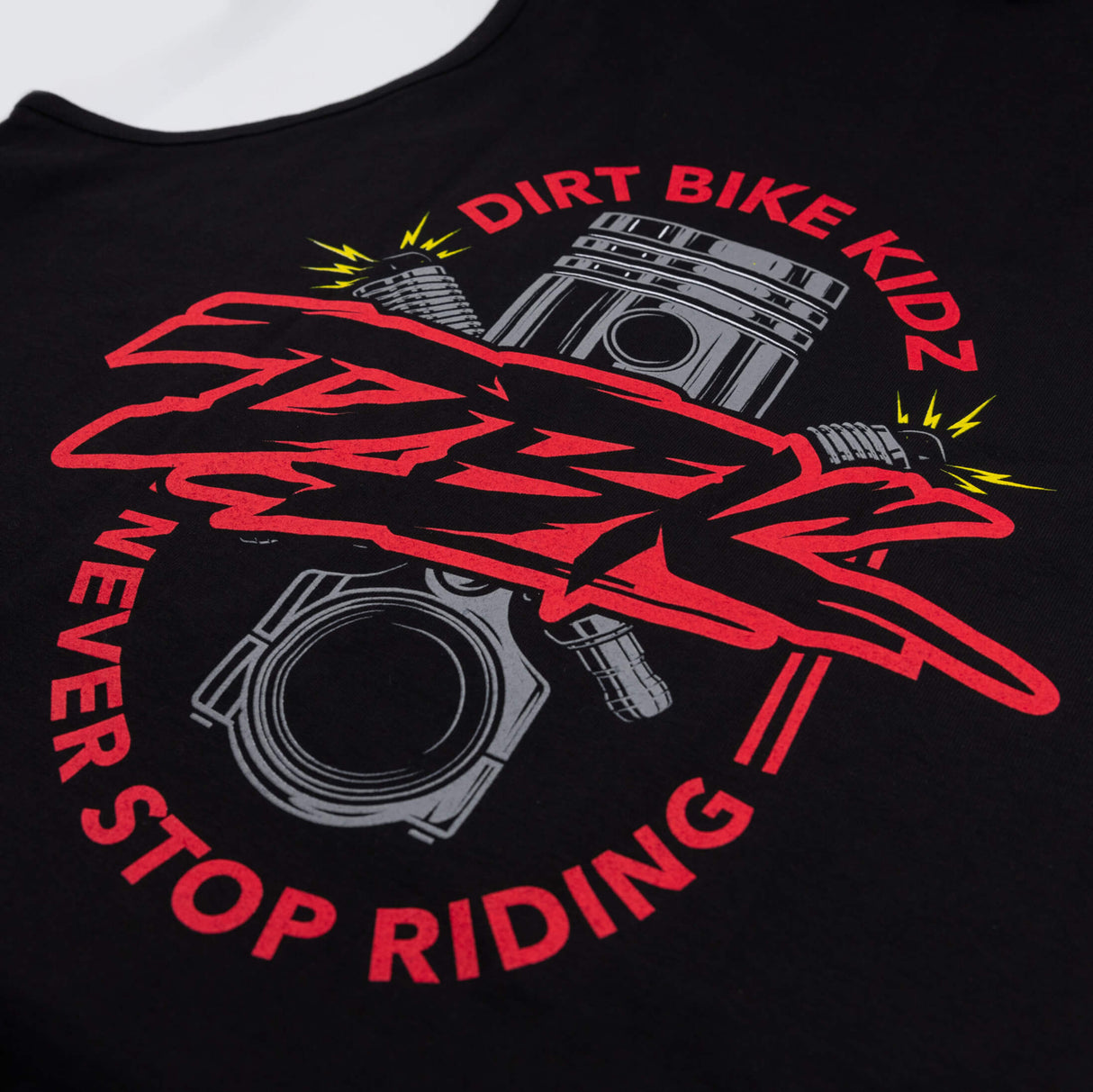 Kids black tank top close-up of large red Dirt Bike Kidz graphic on front