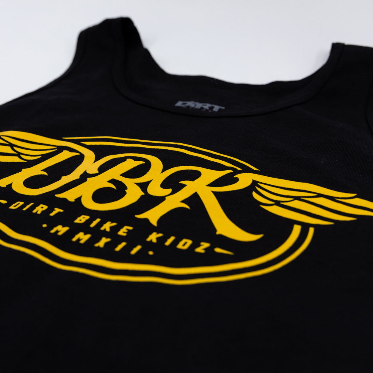 Black tank top close-up of DBK wing graphic and bottom text