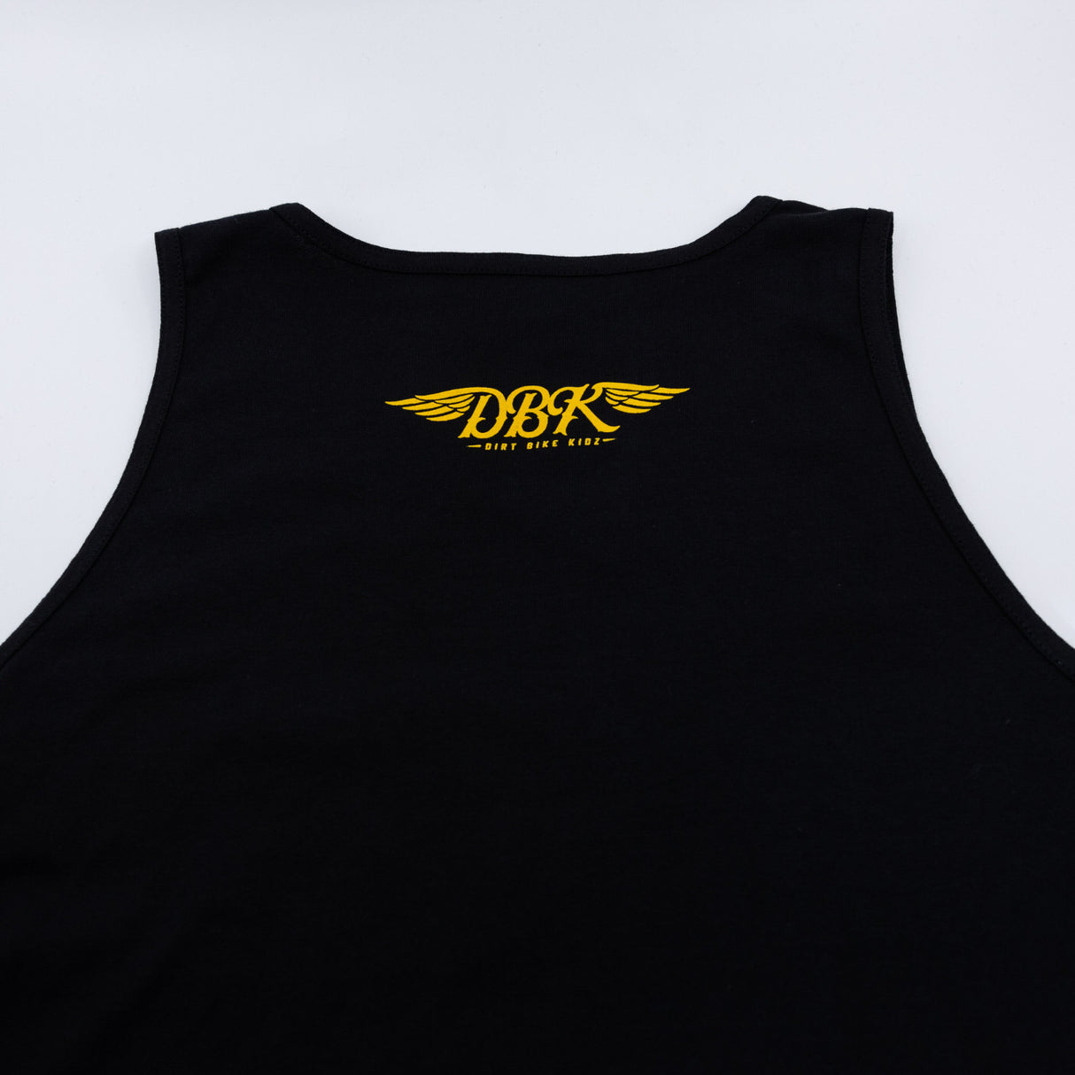 Black tank top back with small yellow DBK wing logo on chest