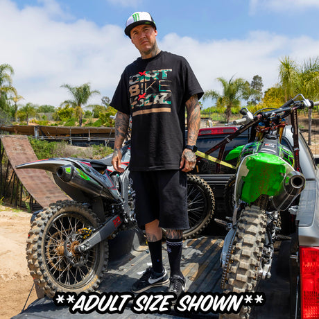 Black youth premium tee on rider; camo Dirt Bike graphic on front