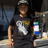 Youth boy wearing a black T-shirt with 'Give Em The Smoke' motocross graphic on the front
