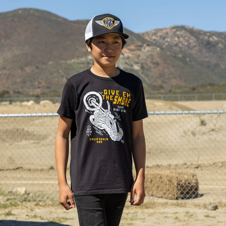 Youth boy wearing a black youth premium T-shirt with 'Give Em The Smoke' front graphic