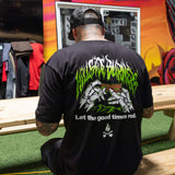 Black T-shirt back with green flame band, illustrated fists, and 'Let the good times roll'