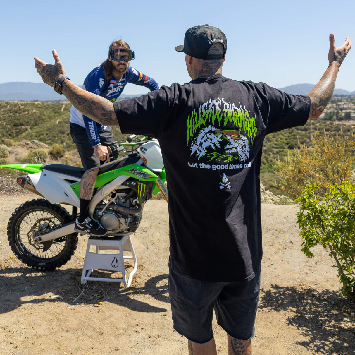 Black long T-shirt with large green flame logo and 'Let the good times roll' on back