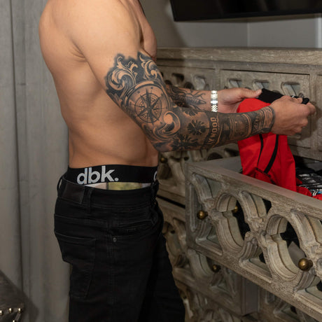 Kid wearing black DBK boxer briefs with motocross-themed print and “dbk” waistband