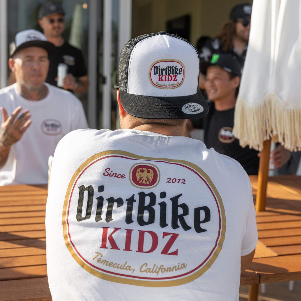 Premium tall tee, white, with DirtBike KIDZ oval back logo graphic