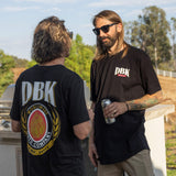 DBK Premium Tall Tee on model, black with DBK Moto Company graphic on back