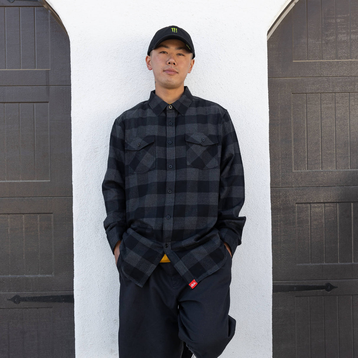 Charcoal plaid flannel button-up shirt worn by person