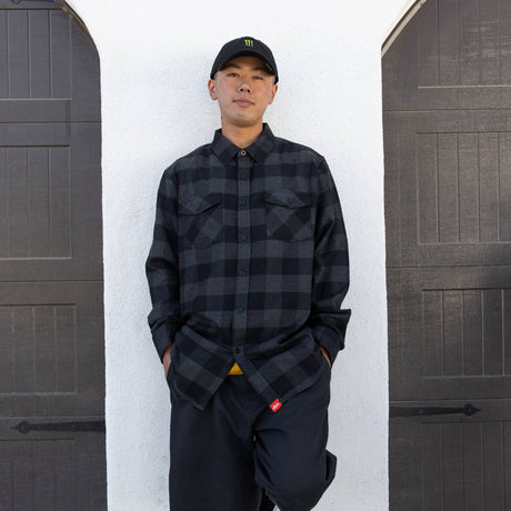 Charcoal plaid flannel button-up shirt worn by person