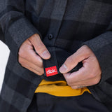 Flannel shirt with button placket and red dbk brand label