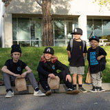 Children wearing black youth tee with blue “DIRT BIKE KIDZ” front graphic